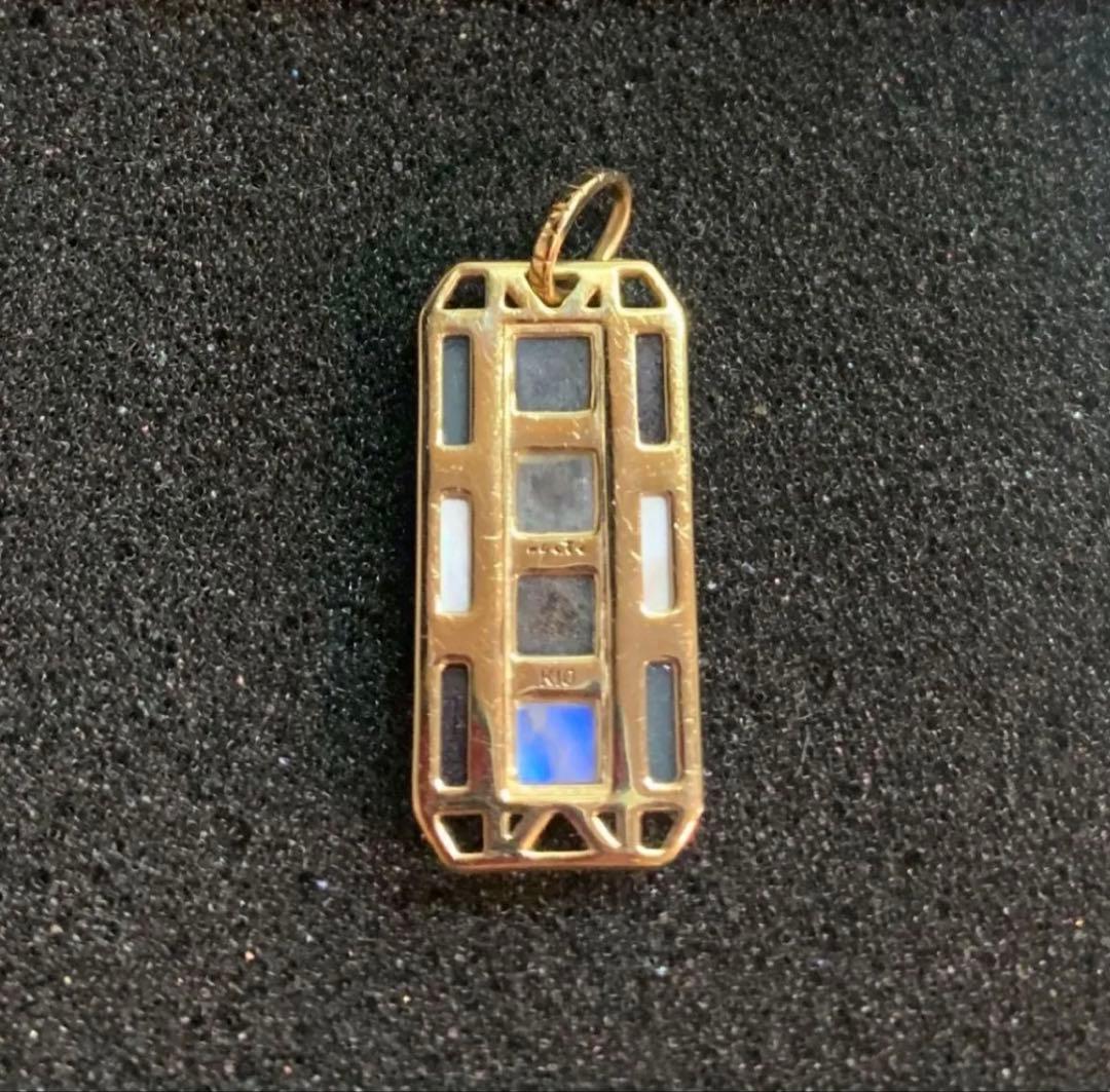 Agete K10 gold necklace charm with multi-stone decorations including labradorite, amethyst, chalcedony, shell, and FE stones