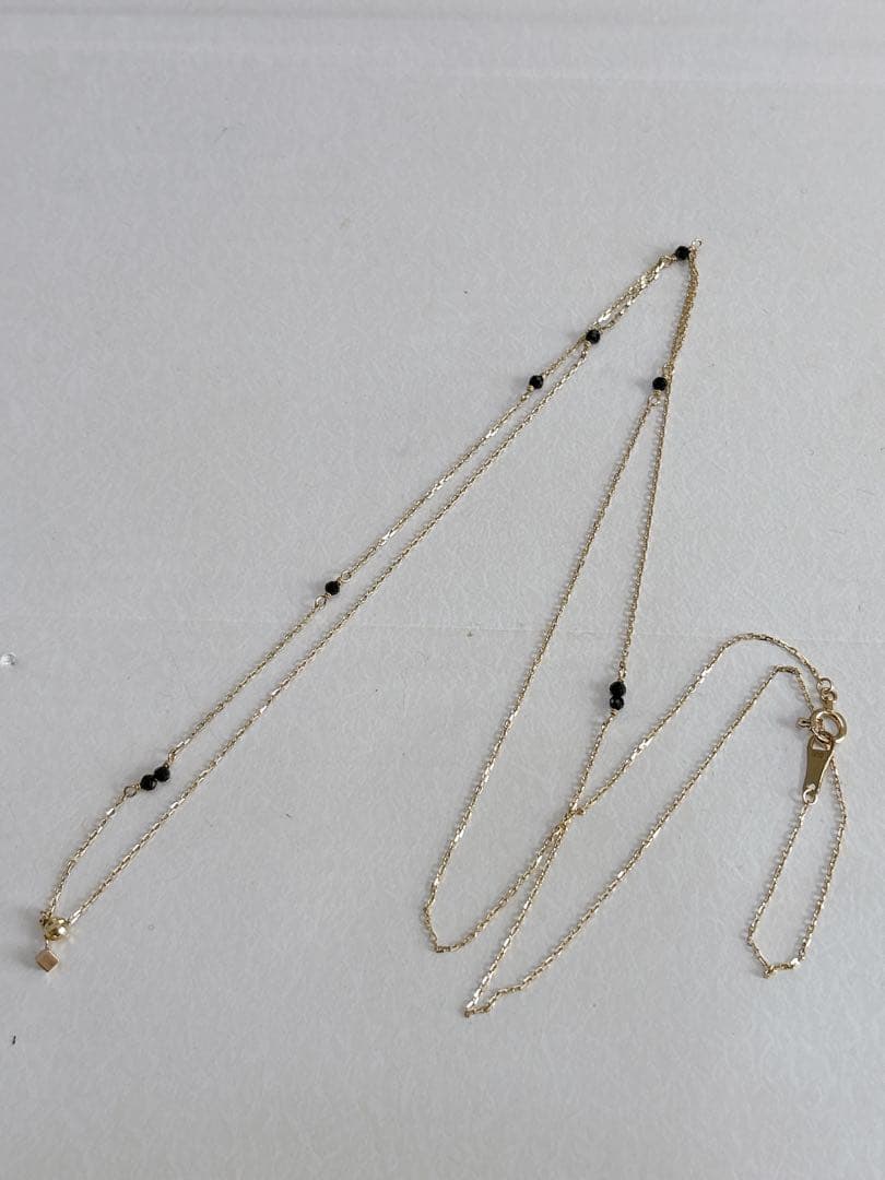 agete K10 Y-shaped necklace with a 70 cm long gold chain displayed on white background