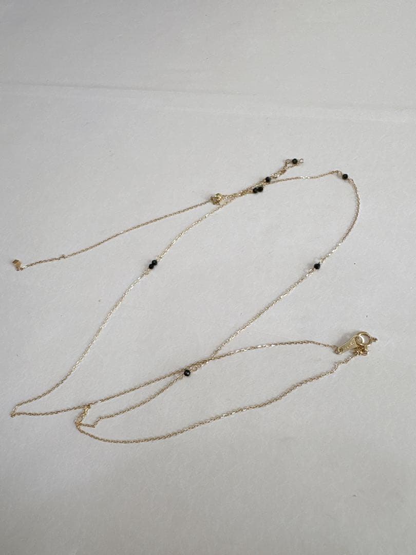 agete K10 Y-shaped necklace with a 70 cm long gold chain displayed on white background