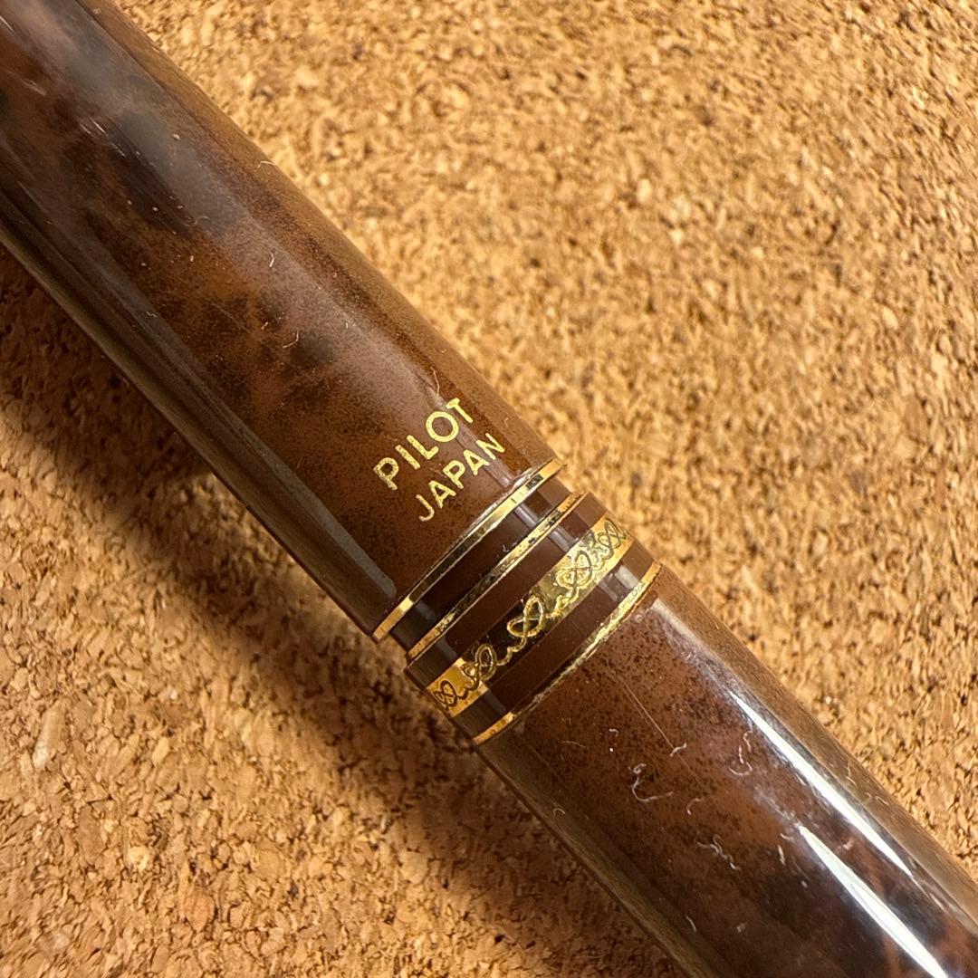 Vintage Pilot fountain pen with marble barrel and fine nib shown uncapped