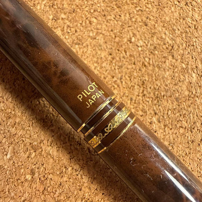 Vintage Pilot fountain pen with marble barrel and fine nib shown uncapped