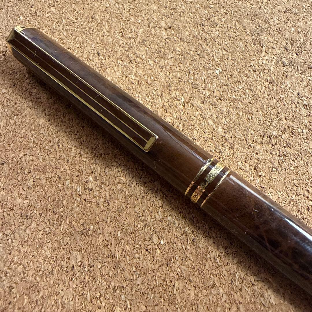 Vintage Pilot fountain pen with marble barrel and fine nib shown uncapped