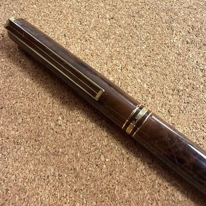 Vintage Pilot fountain pen with marble barrel and fine nib shown uncapped