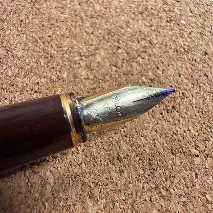 Vintage Pilot fountain pen with marble barrel and fine nib shown uncapped