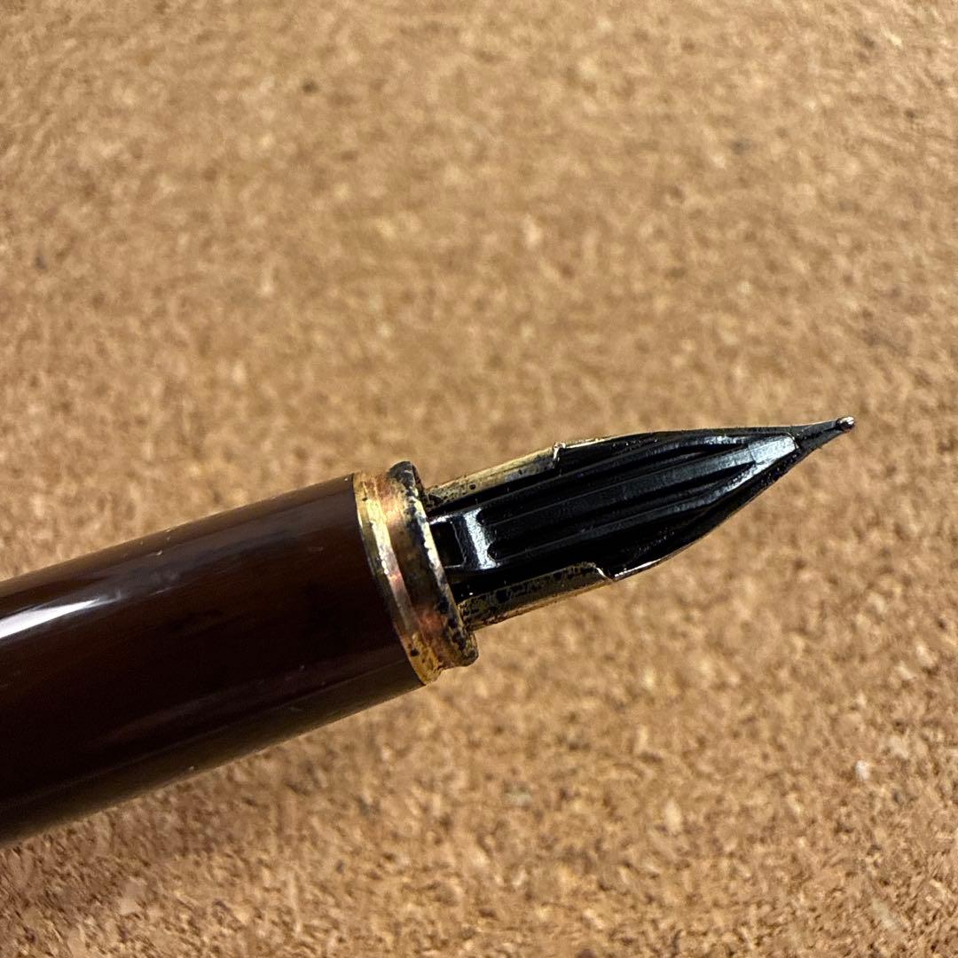 Vintage Pilot fountain pen with marble barrel and fine nib shown uncapped