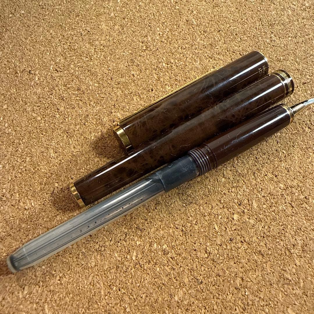 Vintage Pilot fountain pen with marble barrel and fine nib shown uncapped