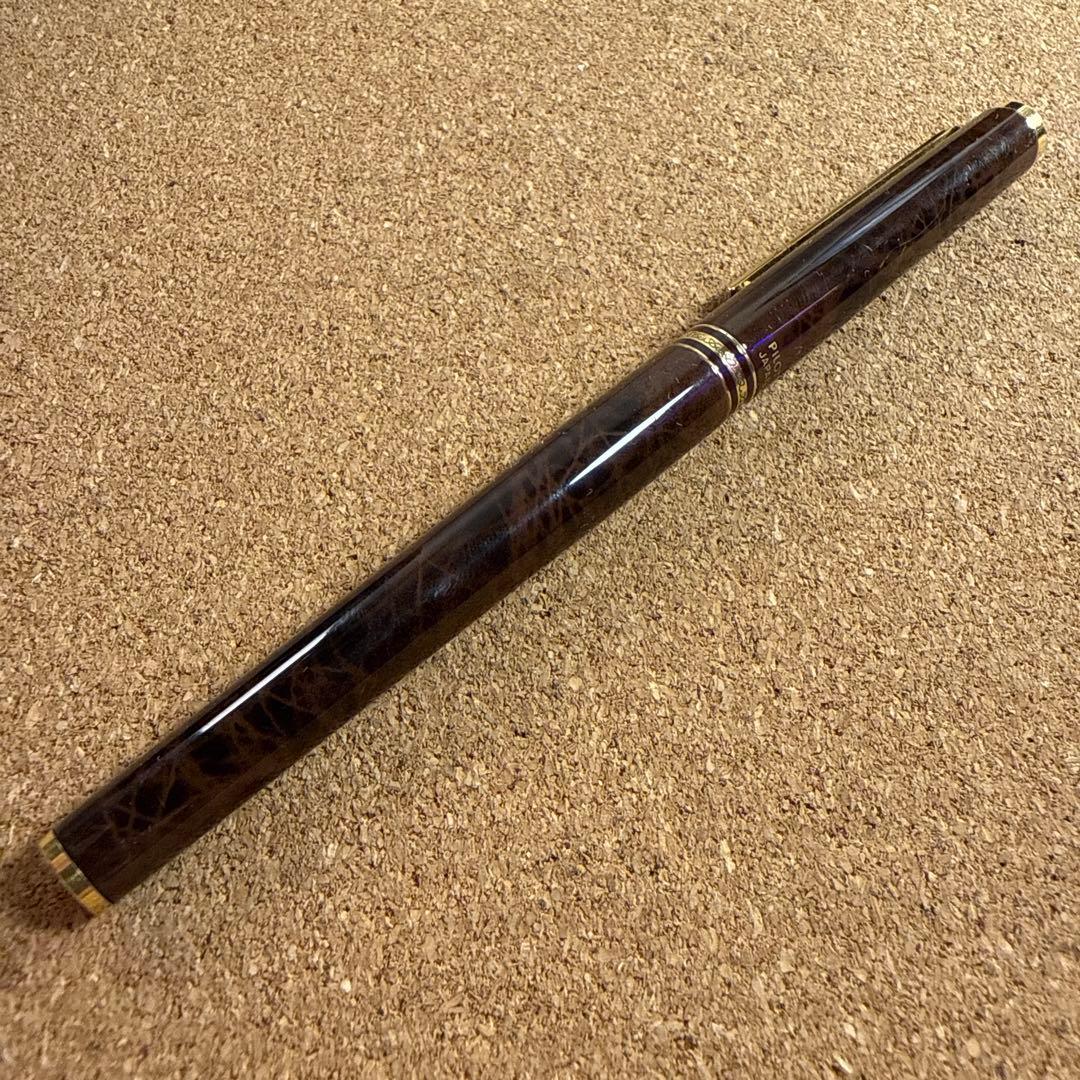 Vintage Pilot fountain pen with marble barrel and fine nib shown uncapped