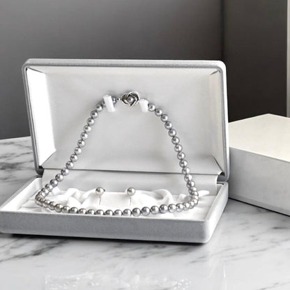 Takashi Akoya pearl necklace and matching earrings with silver clasp featuring 7.5-7 mm pearls