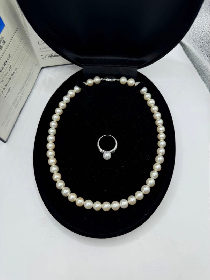 Akoya pearl silver necklace and diamond ring set with pearls sized 8.5 to 9.0 mm displayed on white background