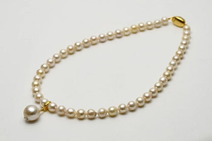 Nanyang White Peacock Akoya pearl pendant necklace featuring 13mm and 8.0-8.5mm baroque pearls with silver fittings