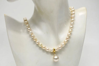 Nanyang White Peacock Akoya pearl pendant necklace featuring 13mm and 8.0-8.5mm baroque pearls with silver fittings