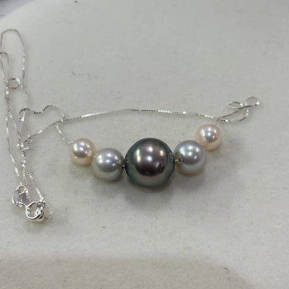 Akoya pearl necklace with black peacock pearl pendant and varying pearl sizes on a 42cm strand