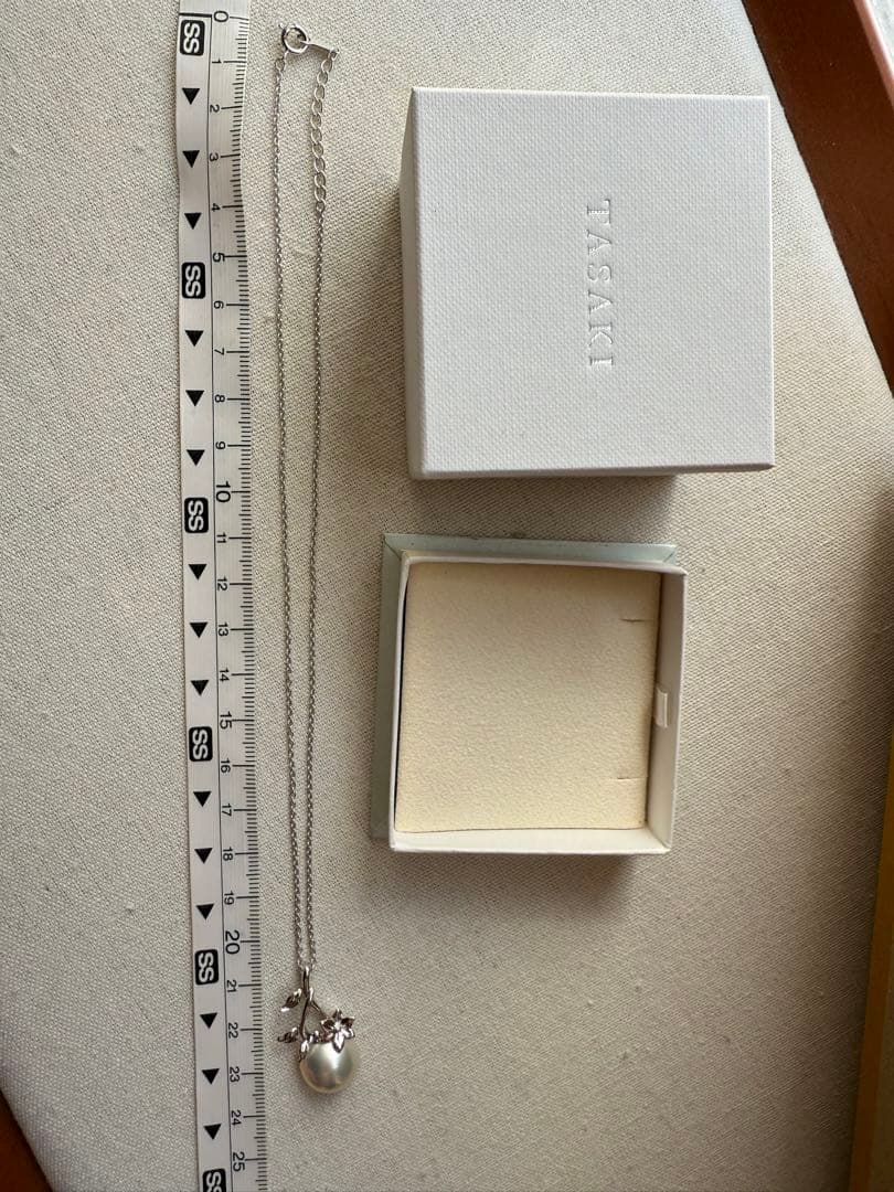 Tasaki Mabe Pearl pendant necklace with 13mm pearl and 42cm chain on white background