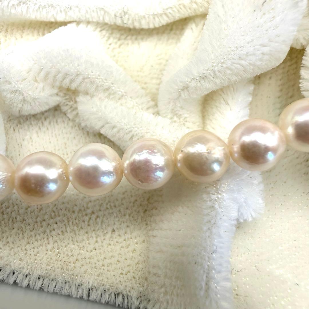 Yamato Akoya white pearl necklace with 5mm pearls and 41cm length displayed on a black background