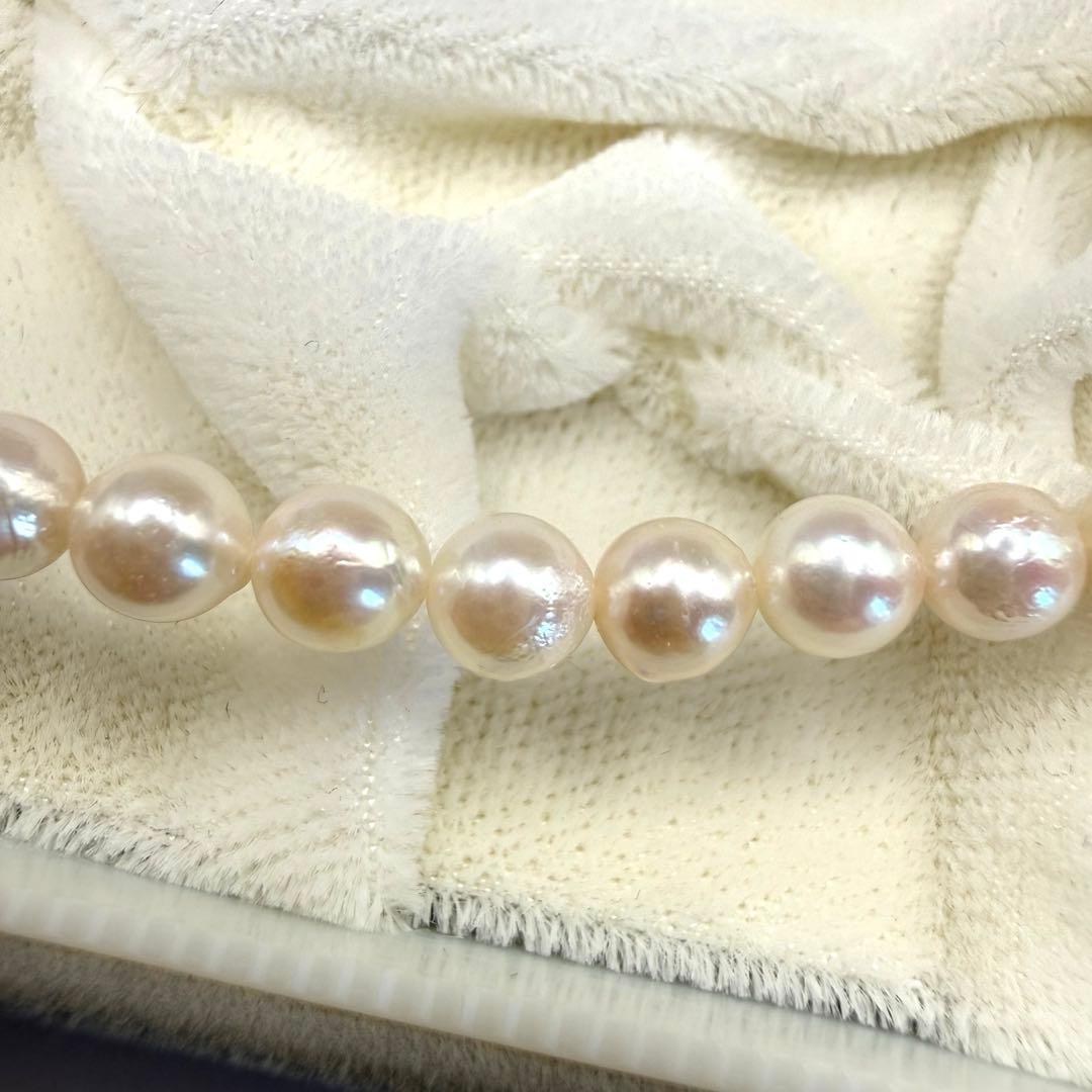 Yamato Akoya white pearl necklace with 5mm pearls and 41cm length displayed on a black background