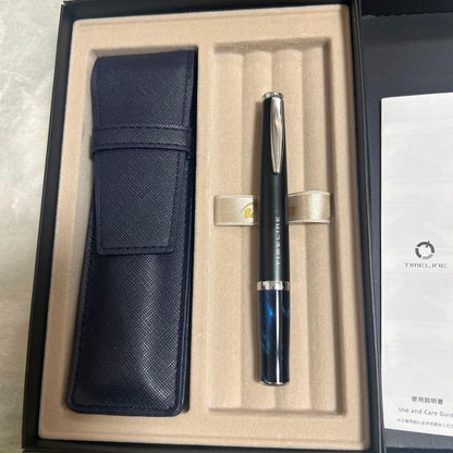 PILOT TIMELINE ballpoint pen with matte black body and blue marble grip alongside dedicated and pen cases