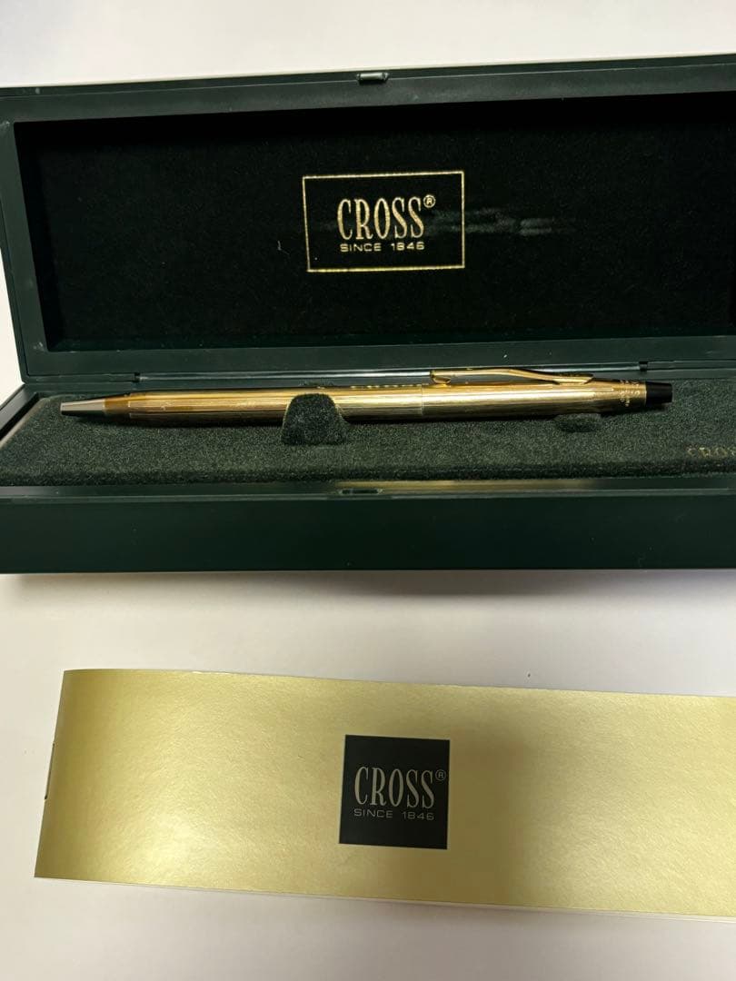 Gold CROSS ballpoint pen model クロ with sleek design and smooth finish