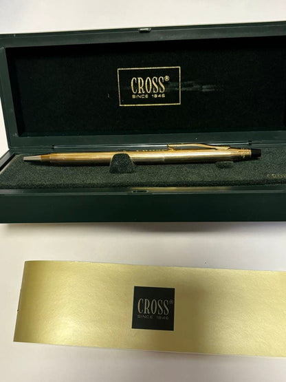 Gold CROSS ballpoint pen model クロ with sleek design and smooth finish