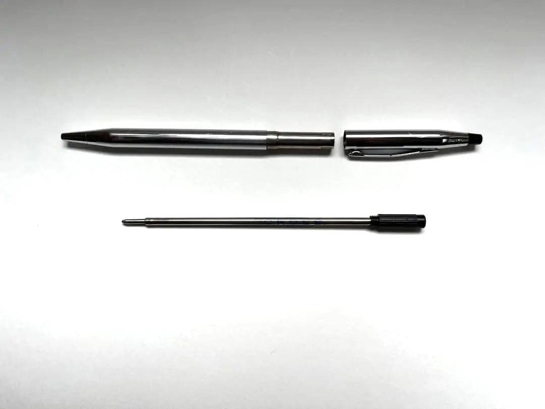 Cross ballpoint pen and mechanical pencil set shown without case, both in good condition with minor signs of use
