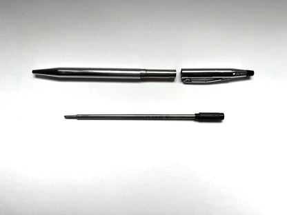 Cross ballpoint pen and mechanical pencil set shown without case, both in good condition with minor signs of use