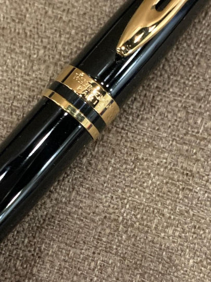 WATERMAN retractable black ballpoint pen with included case showing pen and case exterior