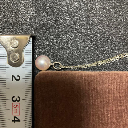 Mikimoto Akoya pearl necklace with silver pendant displayed with dedicated case