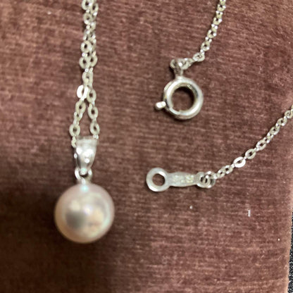 Mikimoto Akoya pearl necklace with silver pendant displayed with dedicated case