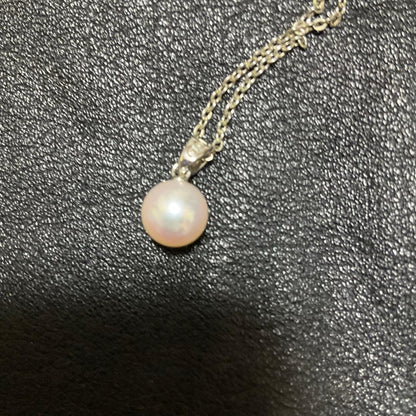 Mikimoto Akoya pearl necklace with silver pendant displayed with dedicated case