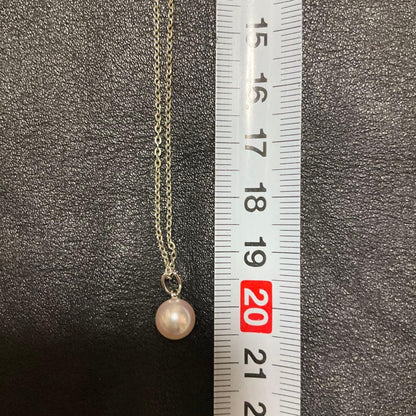 Mikimoto Akoya pearl necklace with silver pendant displayed with dedicated case