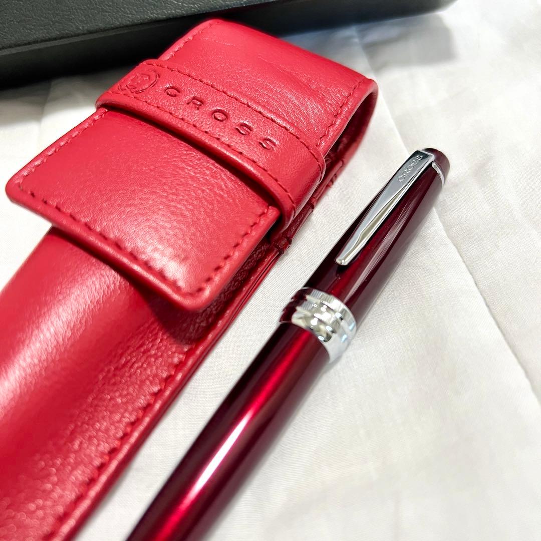 Two new CROSS ballpoint pens with black leather case on white background