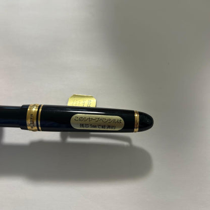 PILOT black ballpoint pen with gold accents and plastic body shown on white background