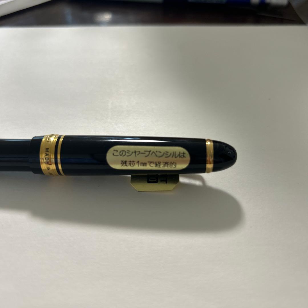 PILOT black ballpoint pen with gold accents and plastic body shown on white background