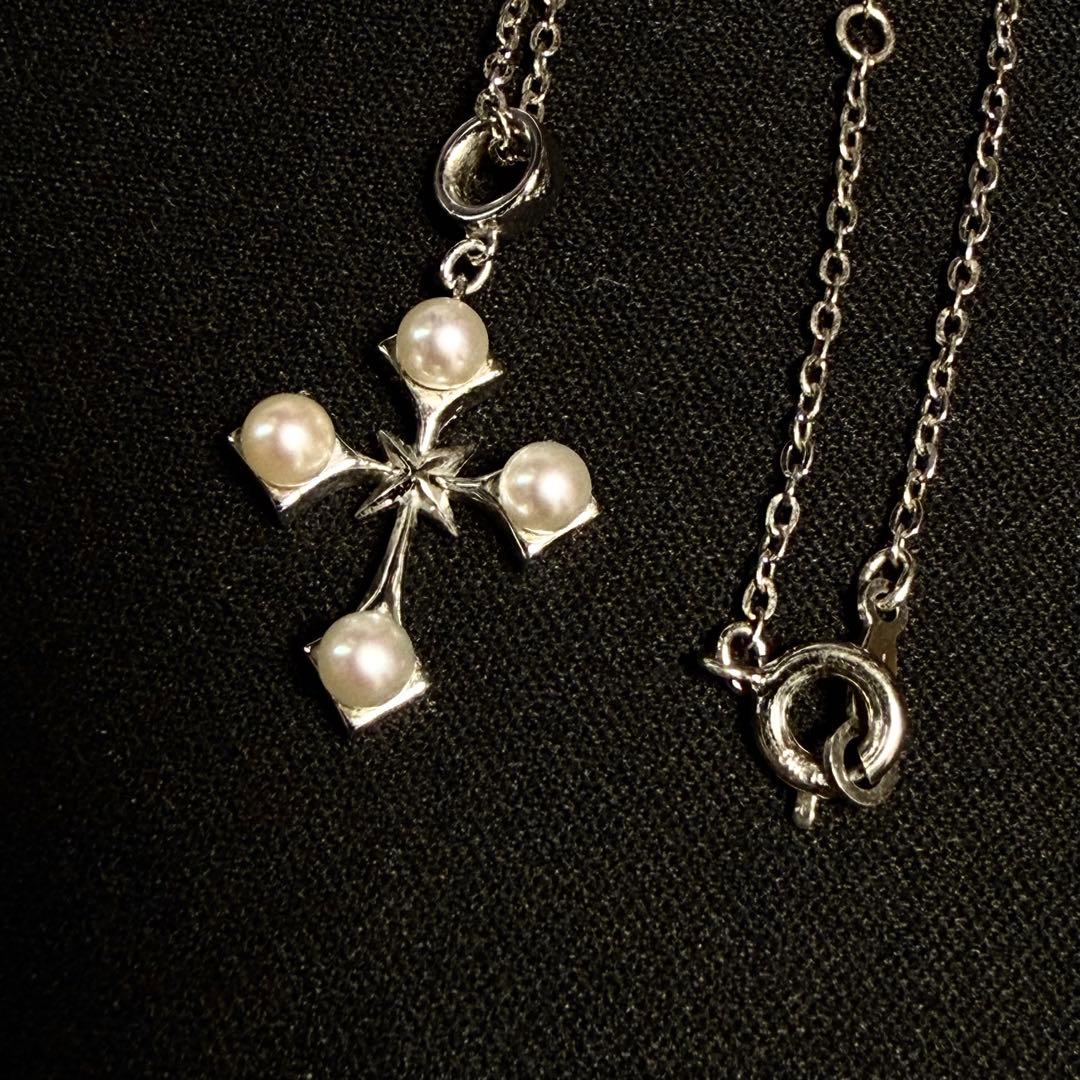 Mikimoto Akoya pearl cross necklace in silver with 19mm pearl and 42cm chain displayed on white background
