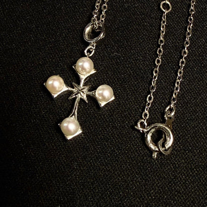 Mikimoto Akoya pearl cross necklace in silver with 19mm pearl and 42cm chain displayed on white background