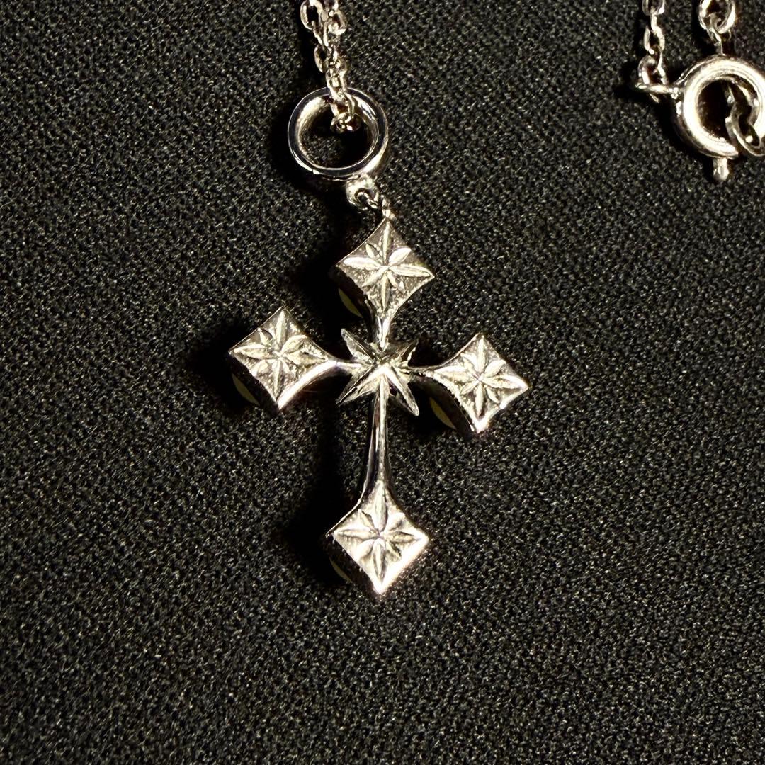Mikimoto Akoya pearl cross necklace in silver with 19mm pearl and 42cm chain displayed on white background