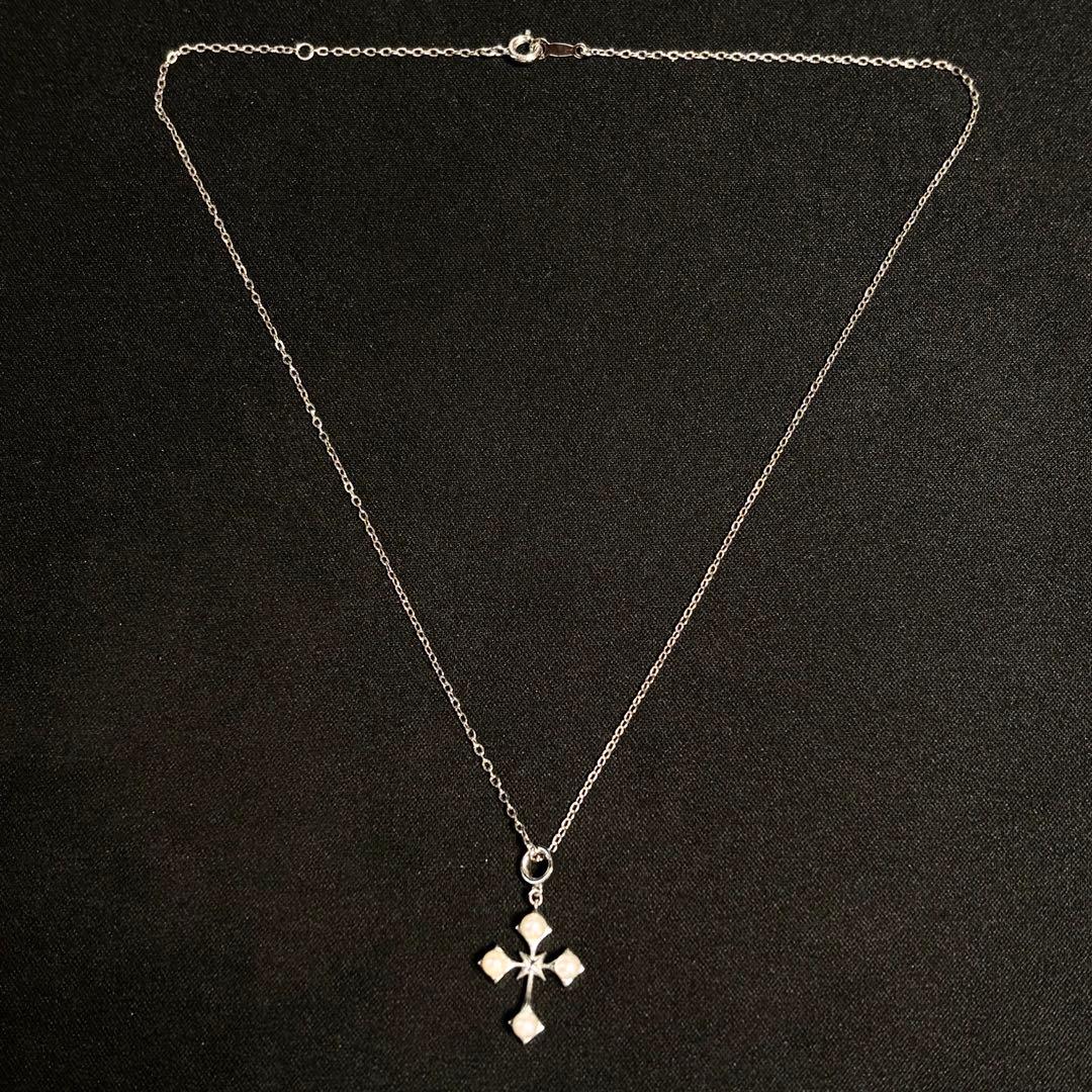 Mikimoto Akoya pearl cross necklace in silver with 19mm pearl and 42cm chain displayed on white background