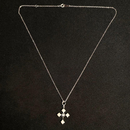 Mikimoto Akoya pearl cross necklace in silver with 19mm pearl and 42cm chain displayed on white background