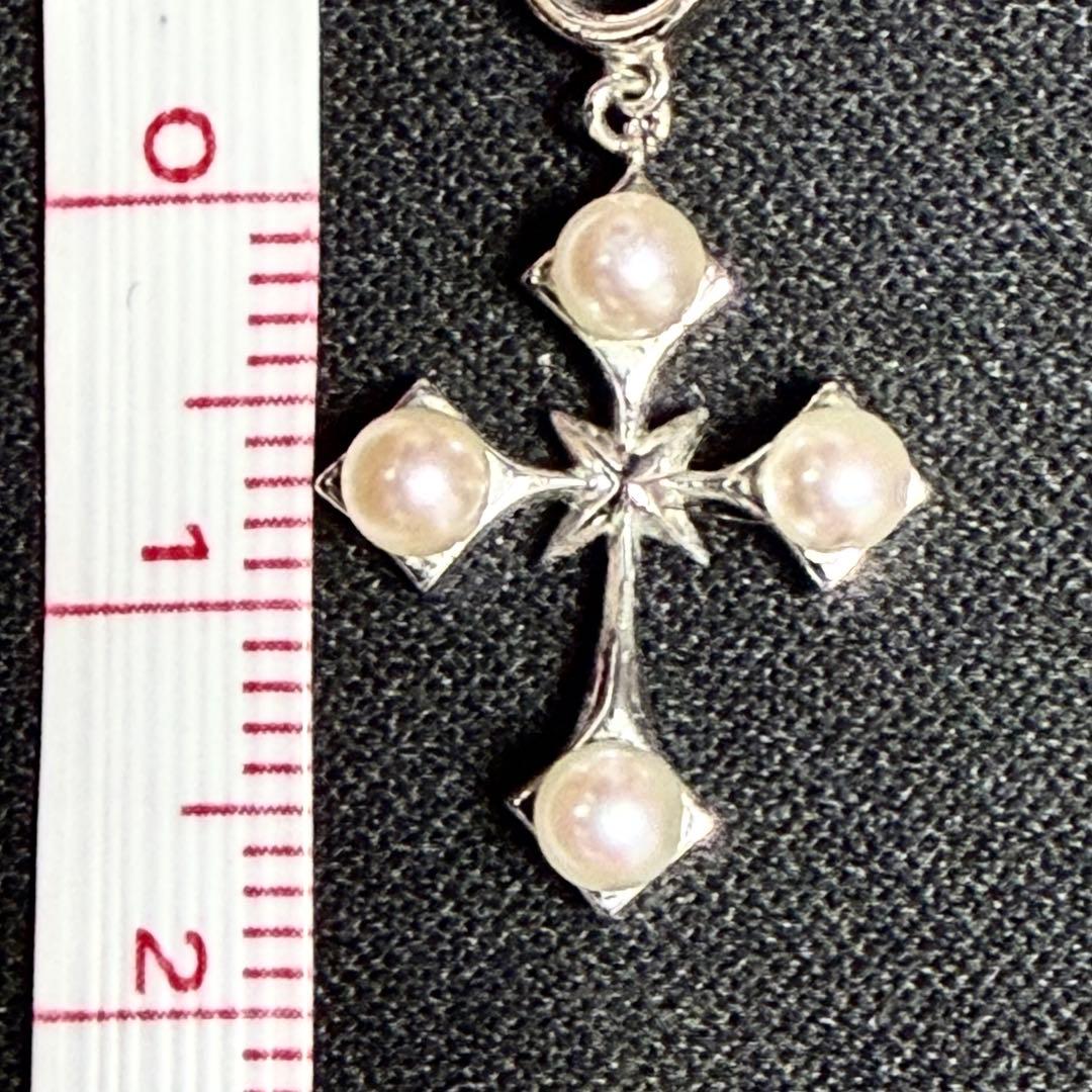 Mikimoto Akoya pearl cross necklace in silver with 19mm pearl and 42cm chain displayed on white background