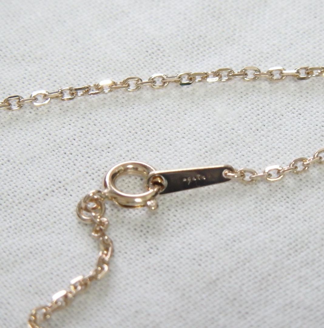 Chain Agete charm featuring topaz and diamond stones set in K10 gold with tourmaline, size 0.8 cm x 0.6 cm