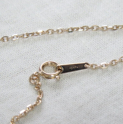 Chain Agete charm featuring topaz and diamond stones set in K10 gold with tourmaline, size 0.8 cm x 0.6 cm