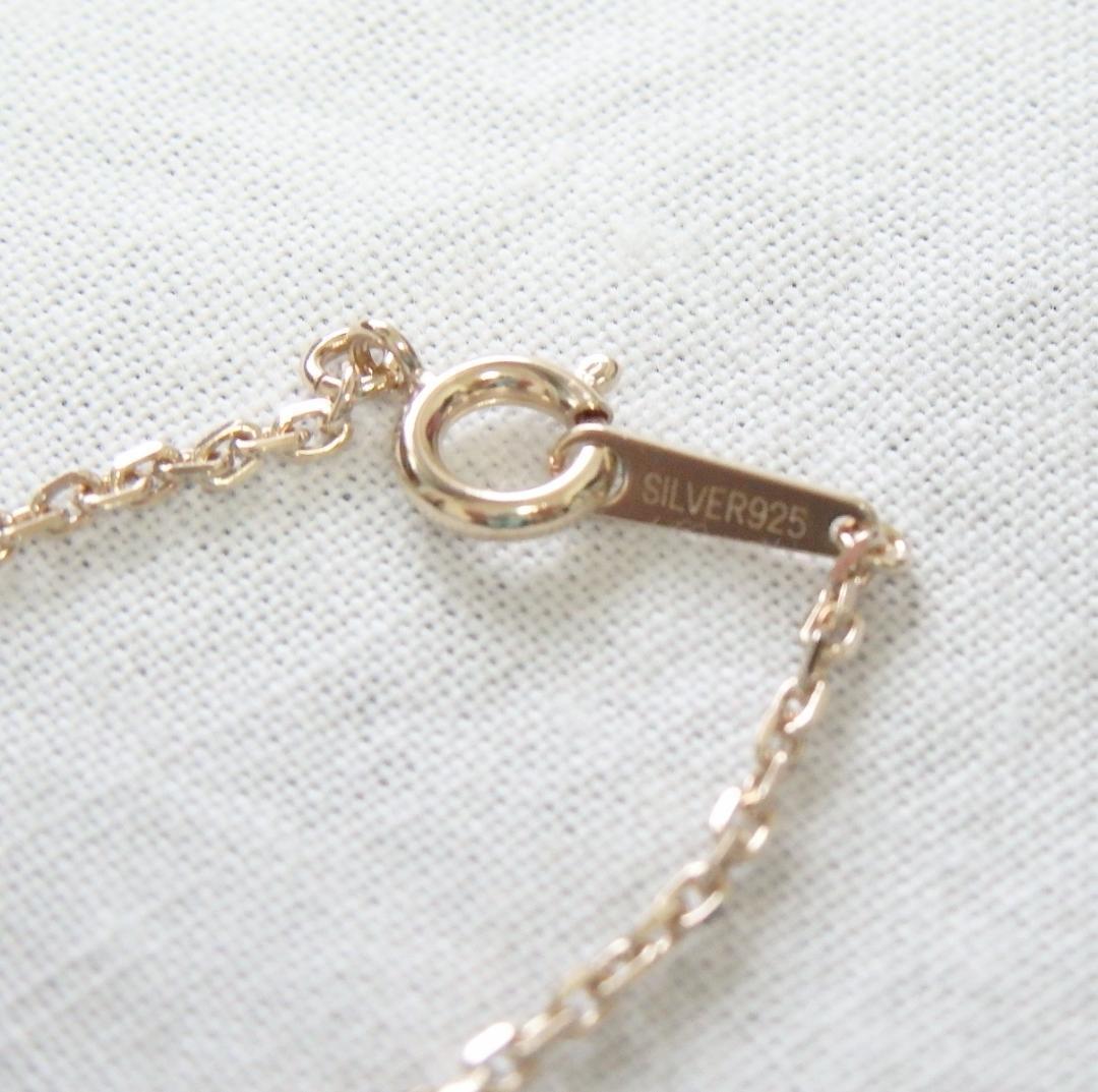 Chain Agete charm featuring topaz and diamond stones set in K10 gold with tourmaline, size 0.8 cm x 0.6 cm