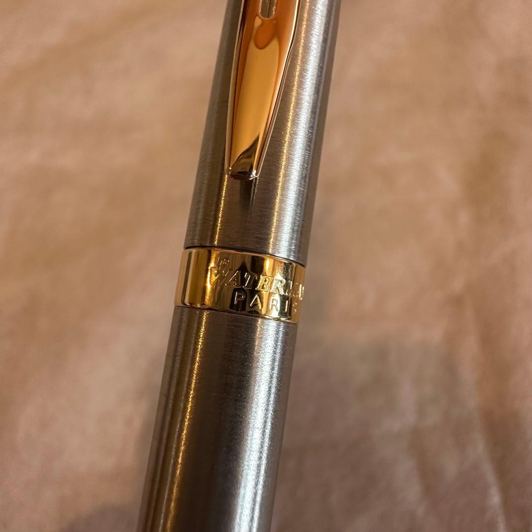 Waterman Ballpoint Pen with sleek black body and silver accents, measuring 14 cm long