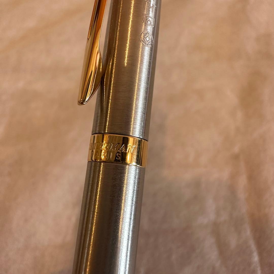 Waterman Ballpoint Pen with sleek black body and silver accents, measuring 14 cm long