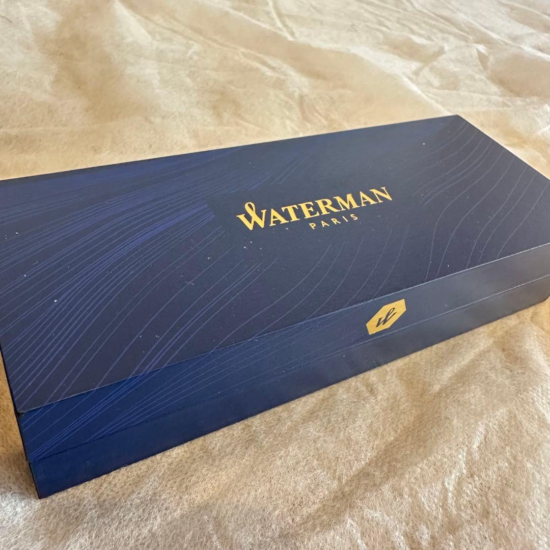 Waterman Ballpoint Pen with sleek black body and silver accents, measuring 14 cm long
