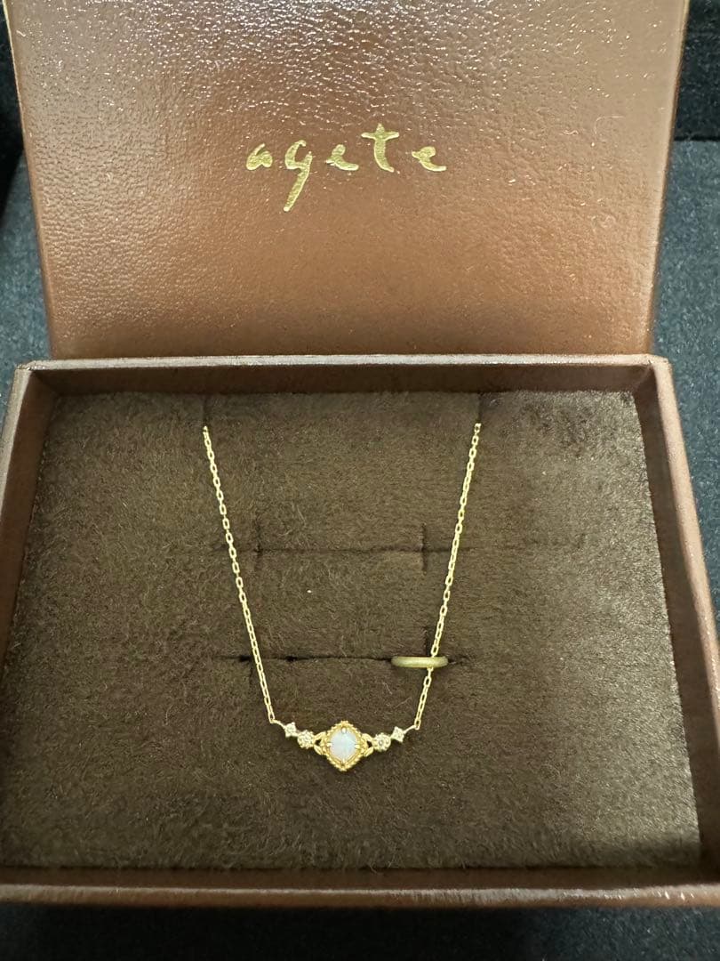 K10 Opal Necklace with opal and diamond accents set in K10 gold on a white background