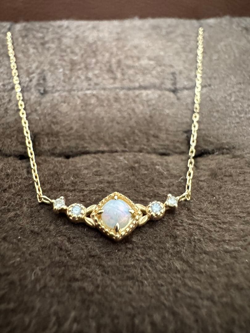 K10 Opal Necklace with opal and diamond accents set in K10 gold on a white background
