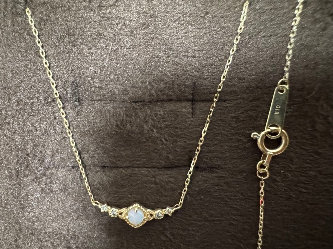 K10 Opal Necklace with opal and diamond accents set in K10 gold on a white background