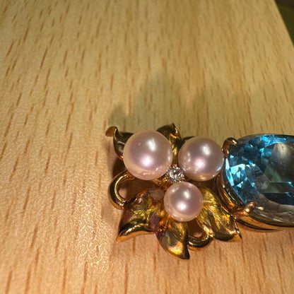 Tasaki necklace with 15.68ct blue topaz, pearl top, and small diamonds set in K18 gold