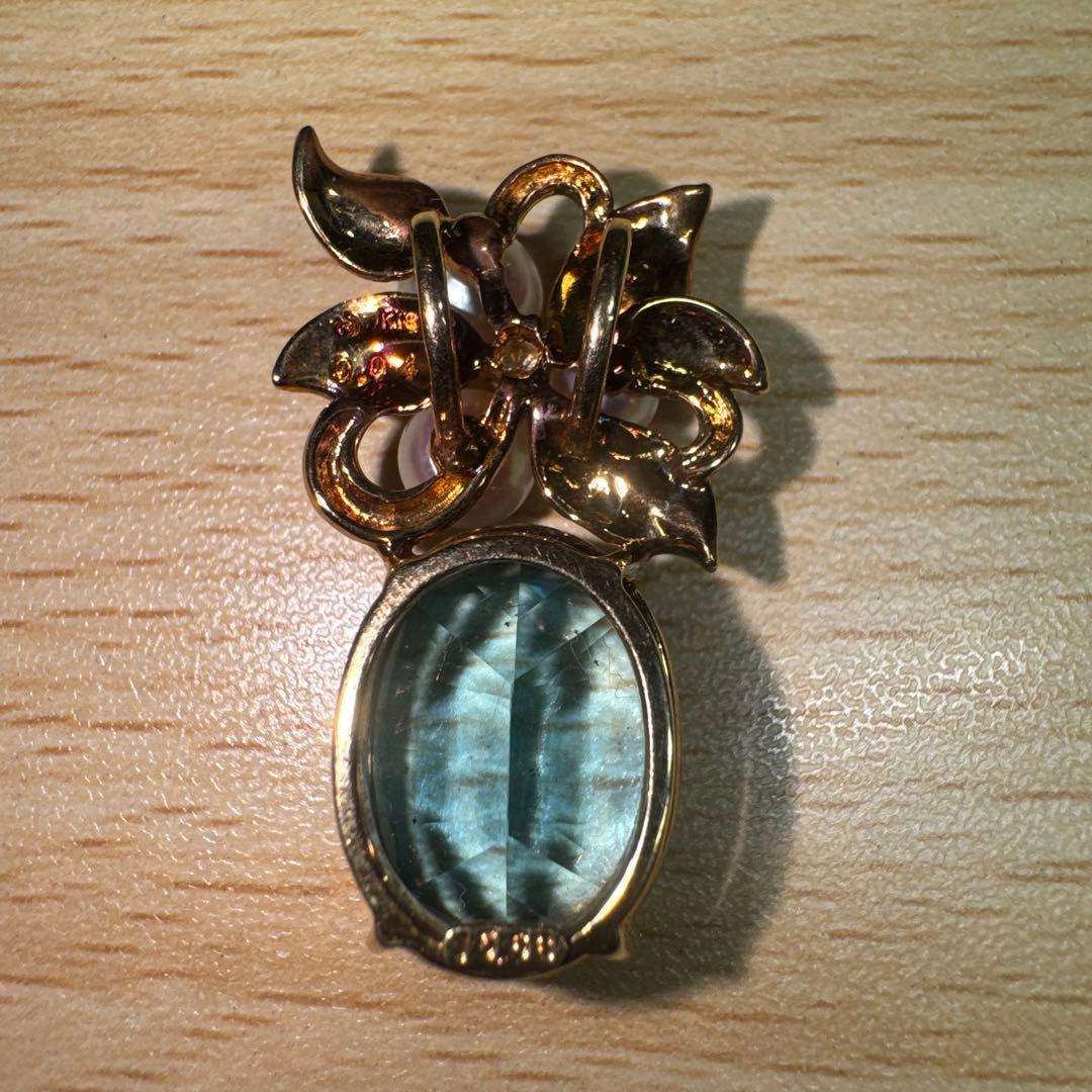 Tasaki necklace with 15.68ct blue topaz, pearl top, and small diamonds set in K18 gold