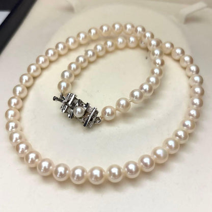 Akoya pearl necklace with 6.5-7.0mm round pearls in champagne gold color, 43cm length